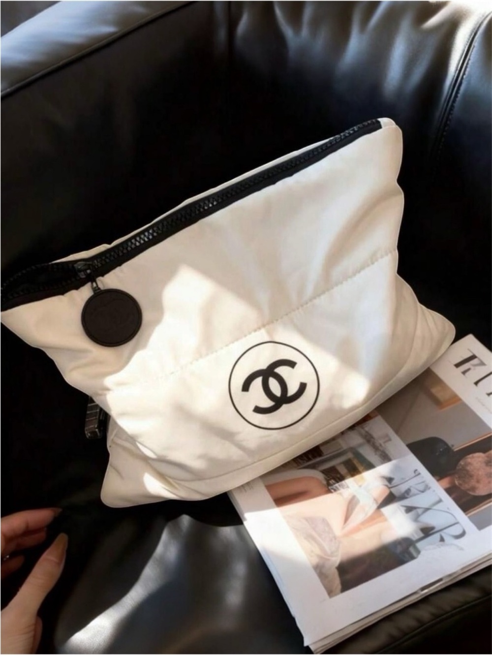 CHANEL White Pouch with Black CC Emblem